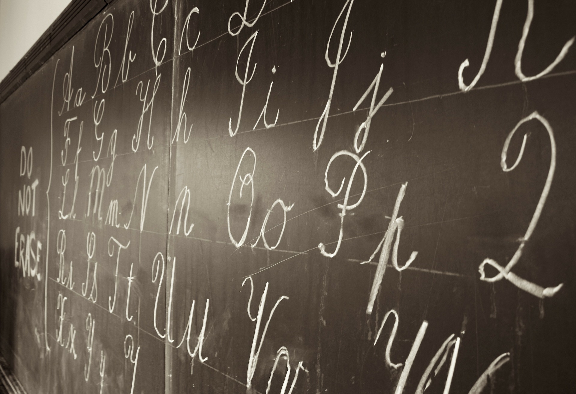 Blackboard with cursive writing in chalk.