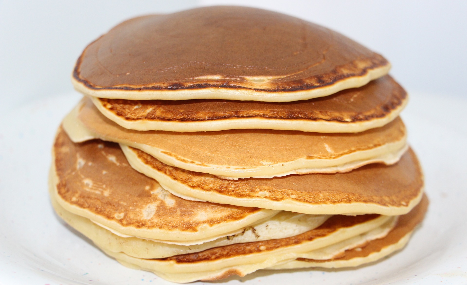 A stack of golden-brown pancakes.