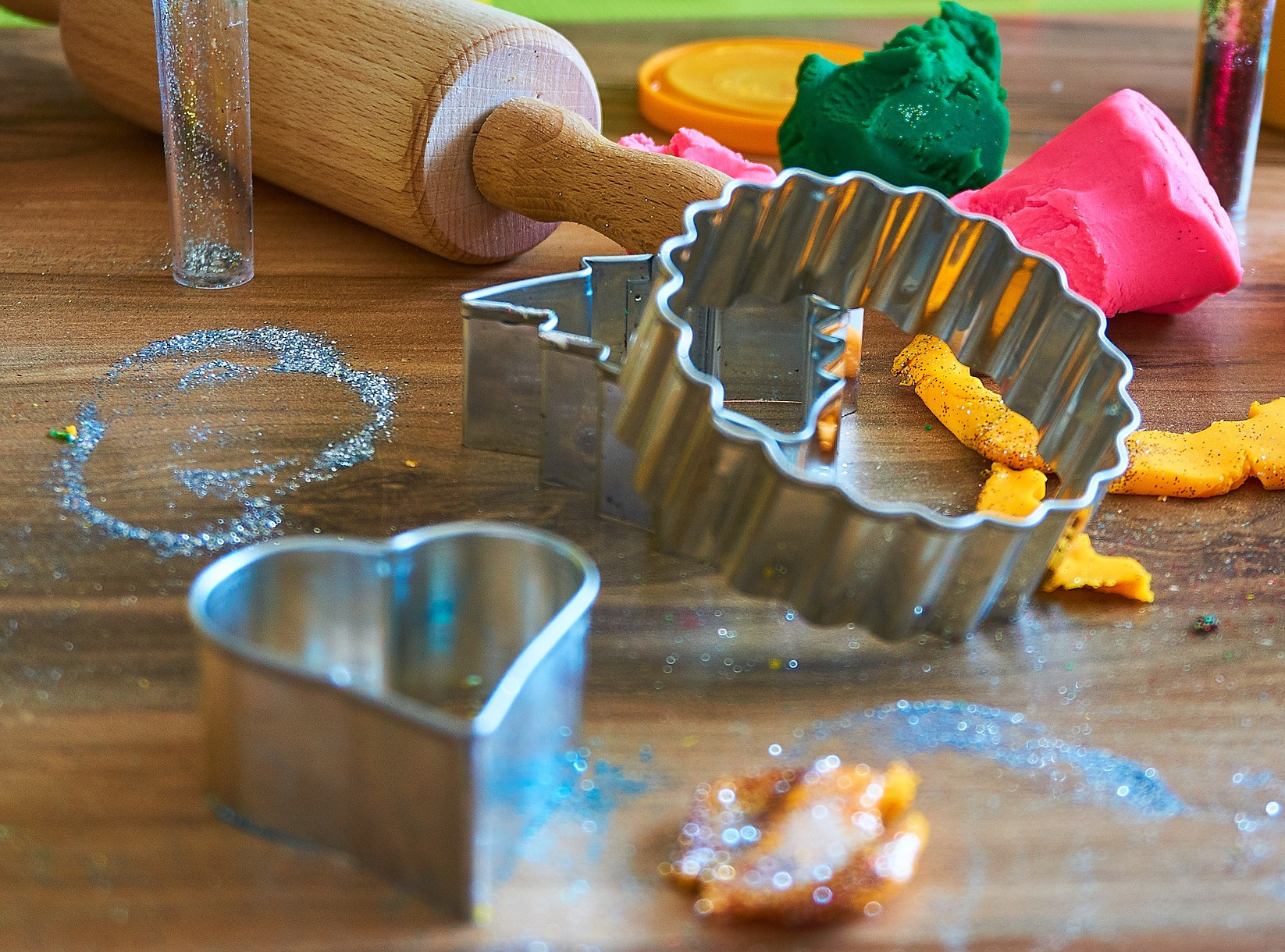 Cookie cutters, rolling pin, glitter, and homemade play dough