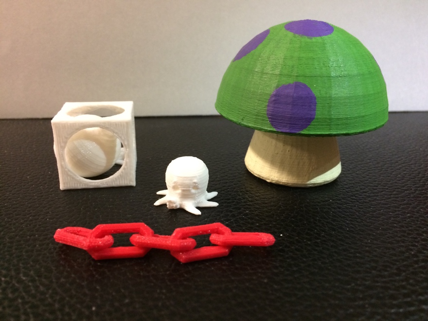 Several 3D models in white, red, and painted.