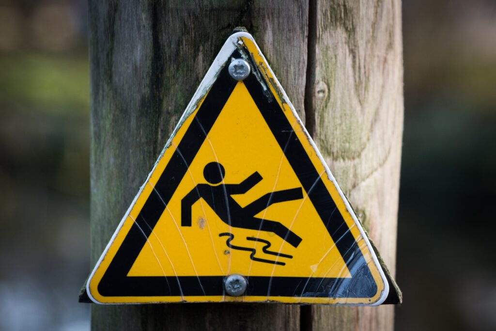 Caution sign of a person slipping.